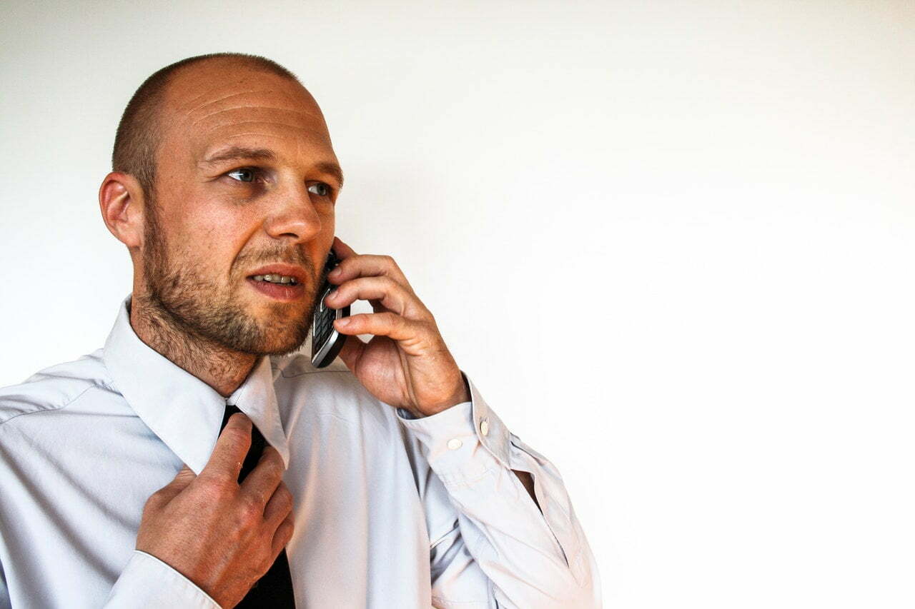 a man talking on a cell phone