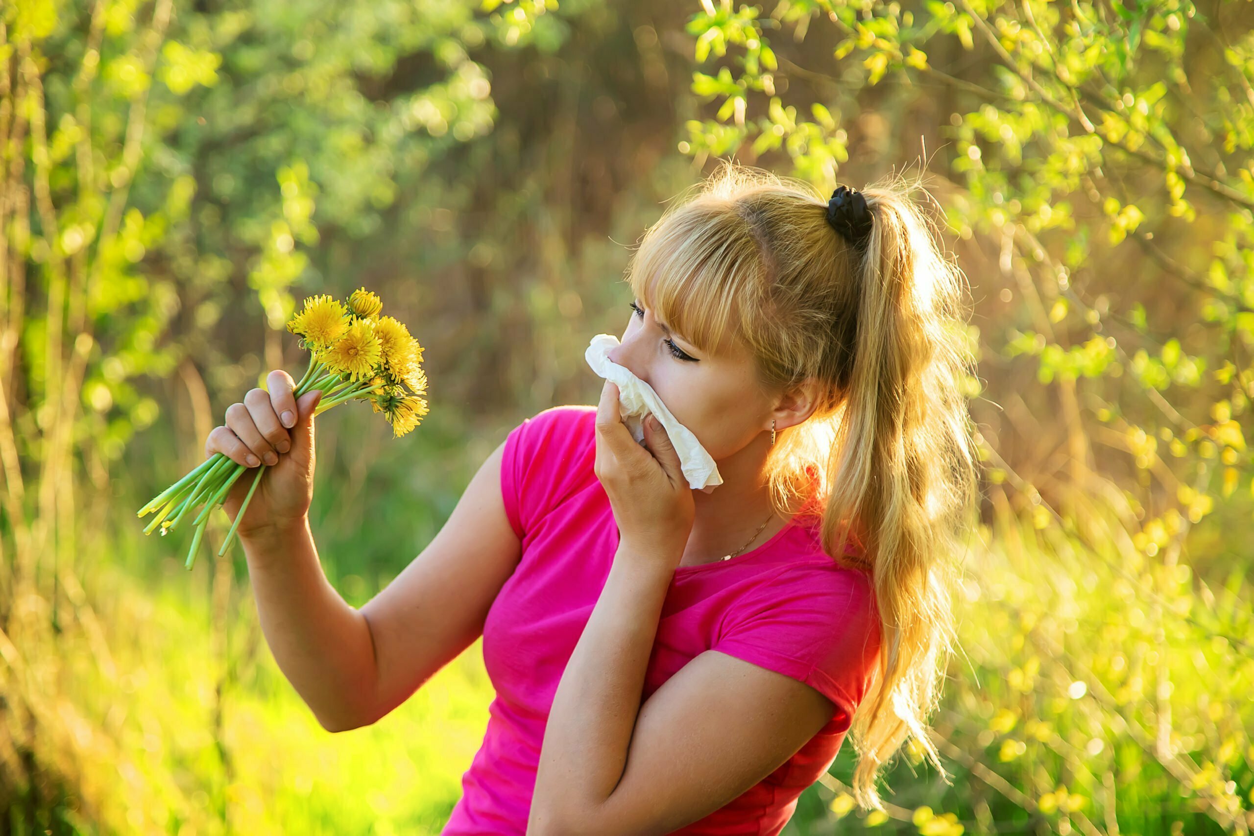 The woman is allergic to flowers. Selective focus.