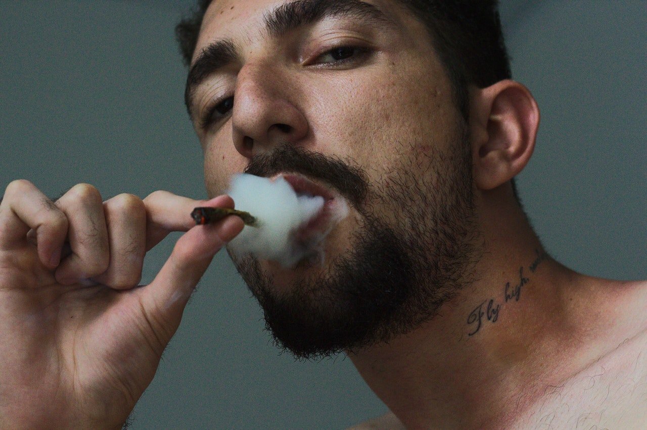What You Should Know About Driving High In California 1 Man Smoking Weed