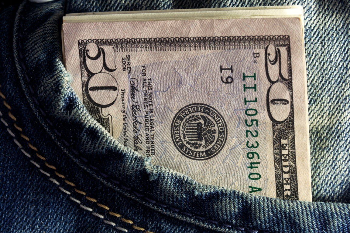 3 Hot Ways to Save Money on Your Home Heating Bills This Winter 1 Money in a Persons Pocket