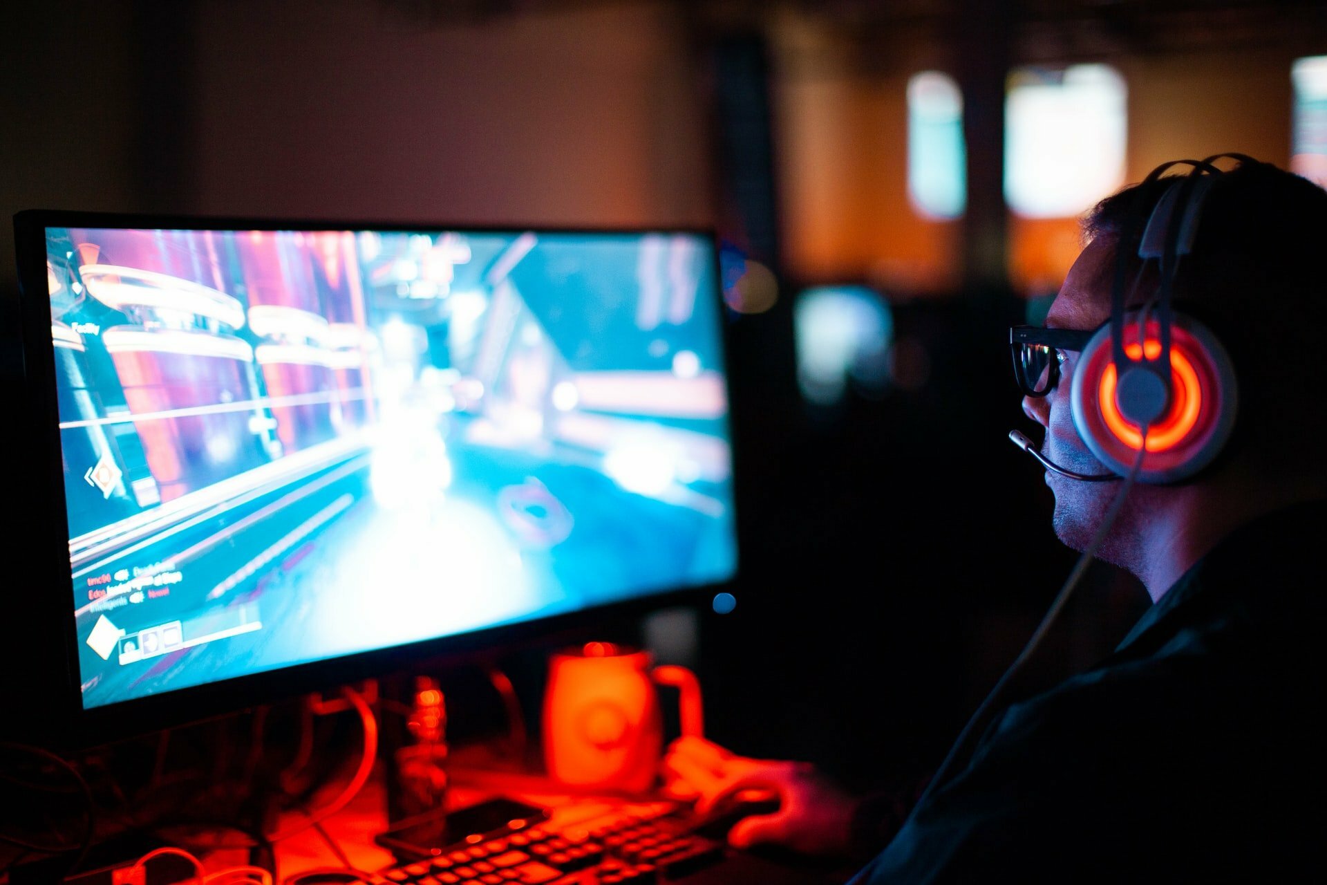 a person wearing headphones and playing a video game