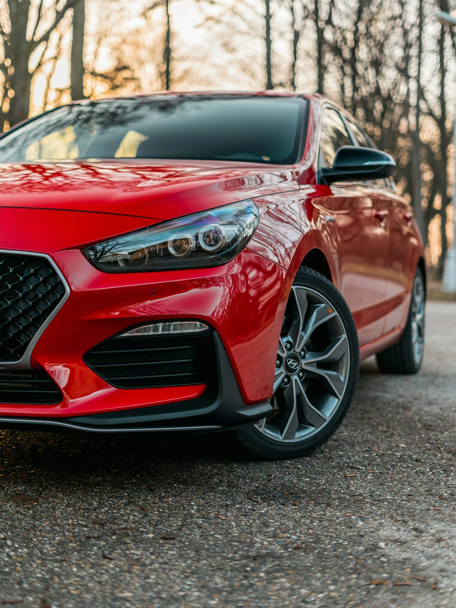 a red car parked on a road
