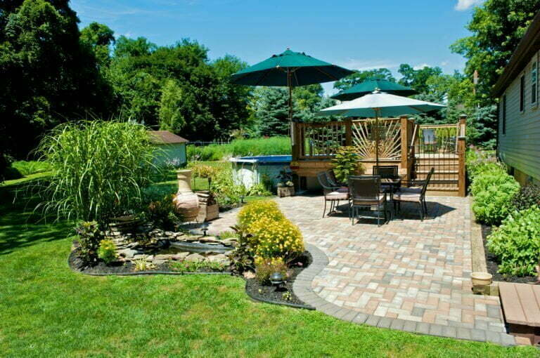 a patio with a table and chairs