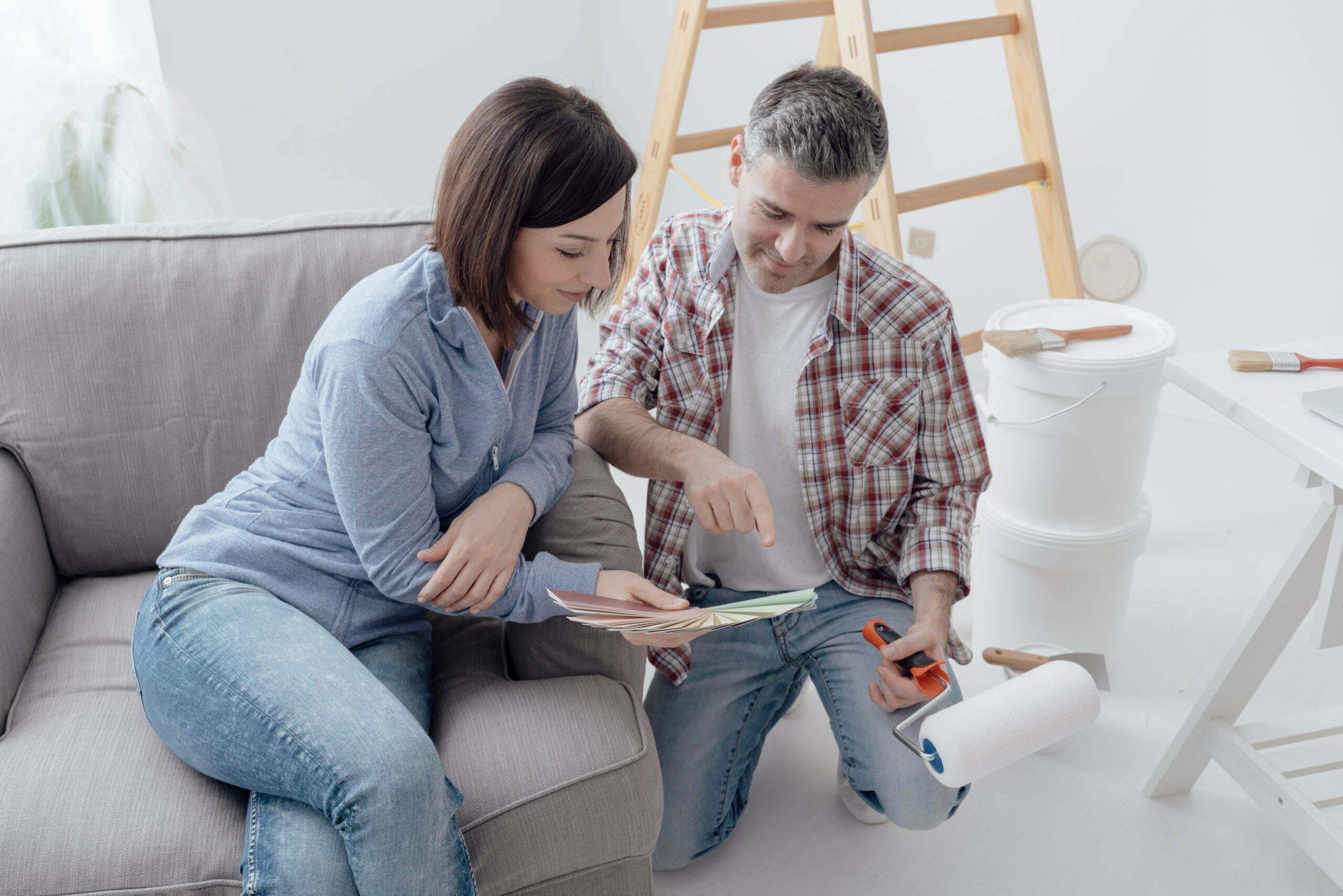 a man and woman looking at a tablet
