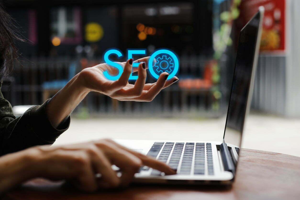 hands holding a laptop