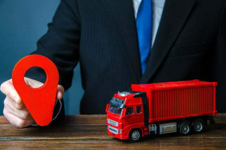 a person holding a toy car