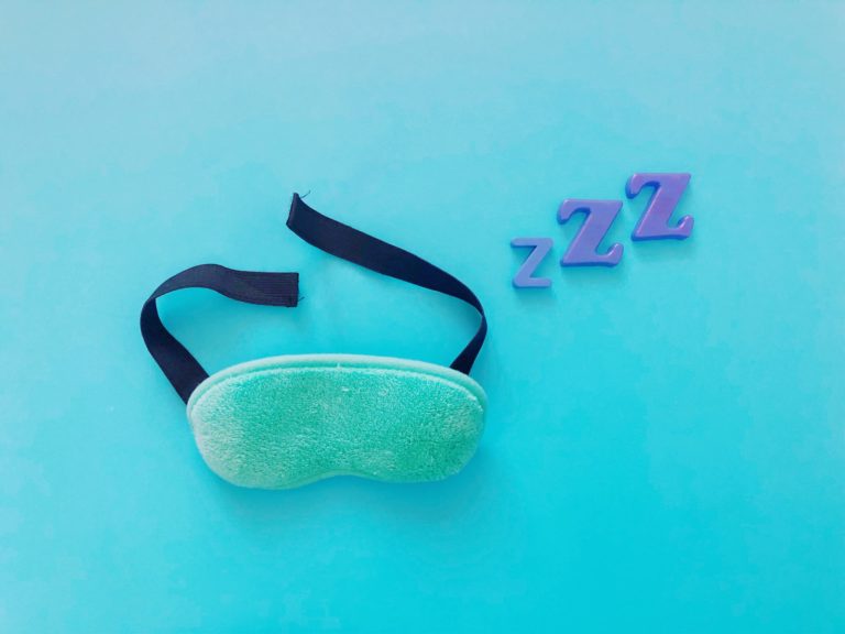 sleeping mask with zzz's over it