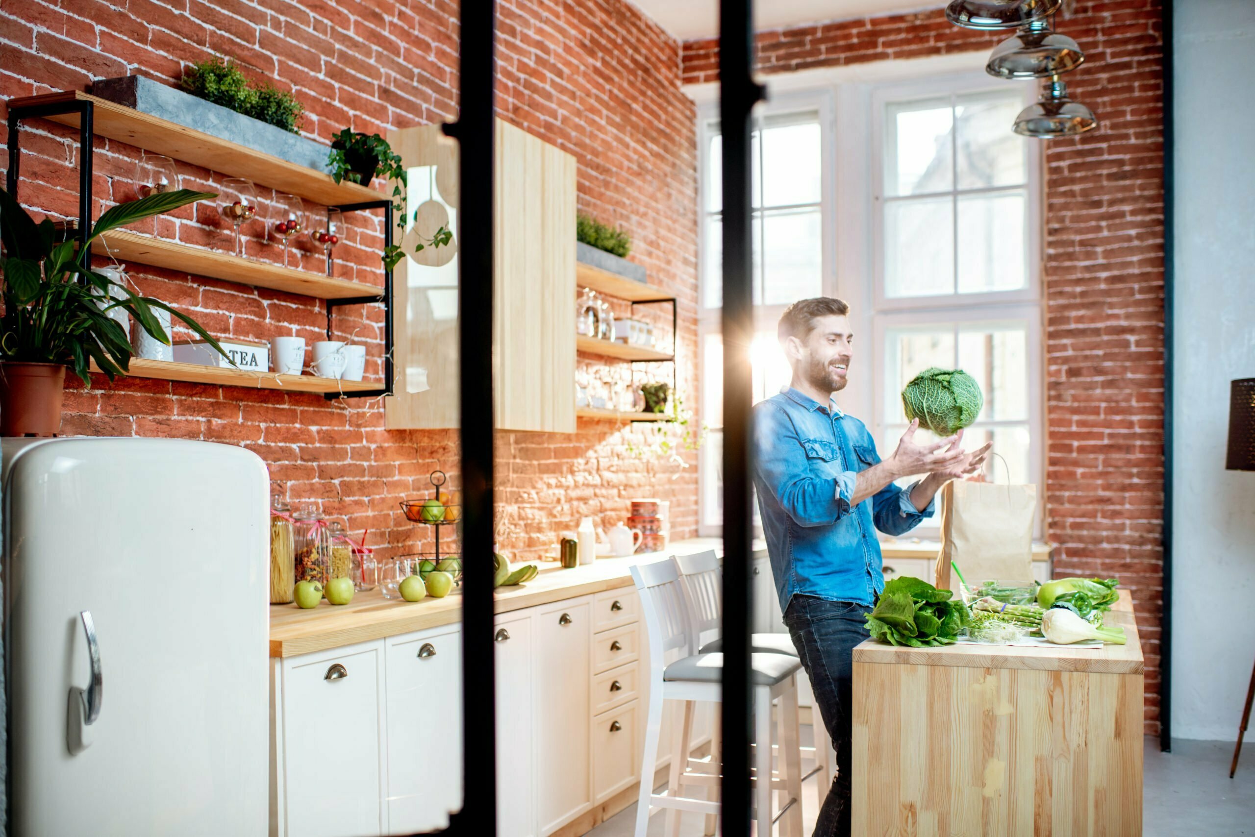 Man with healthy food on the kitchen