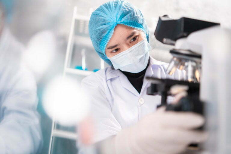 Health care researchers working in life science laboratory, medical science technology research